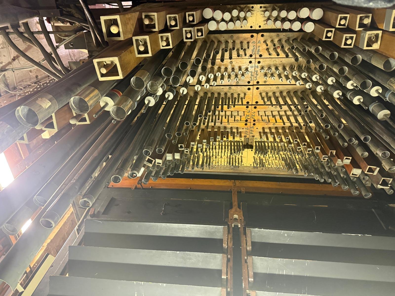 Interior view looking up through the organ pipework